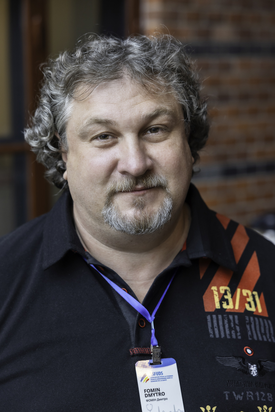 Portrait of a man with curly grey hair